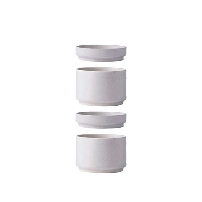 Stacked minimalist white ceramic containers, modern design