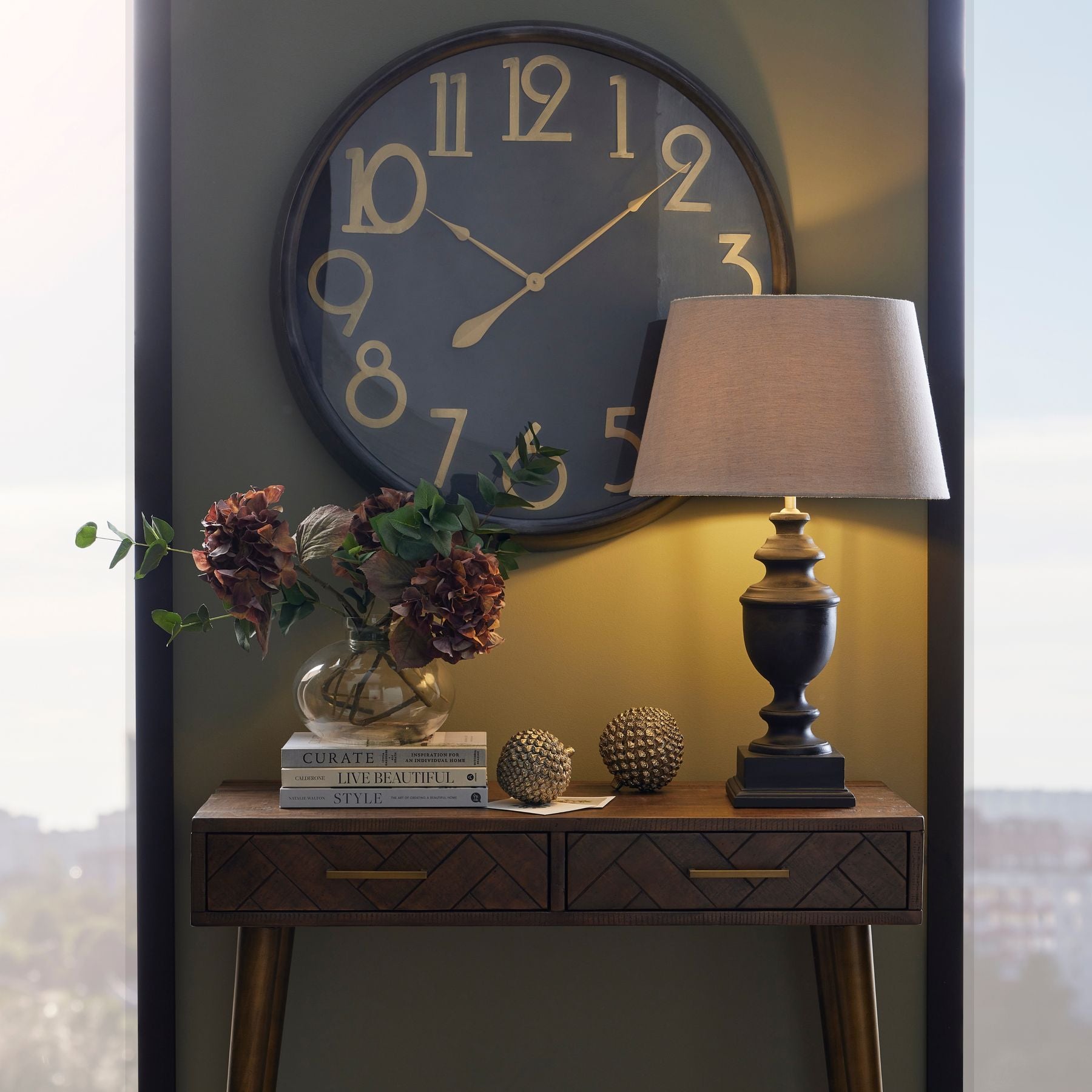 Soho Brass And Black Large Clock – Luxury Furniture by Vendor. Modern design with brass numerals for high-end home decor.