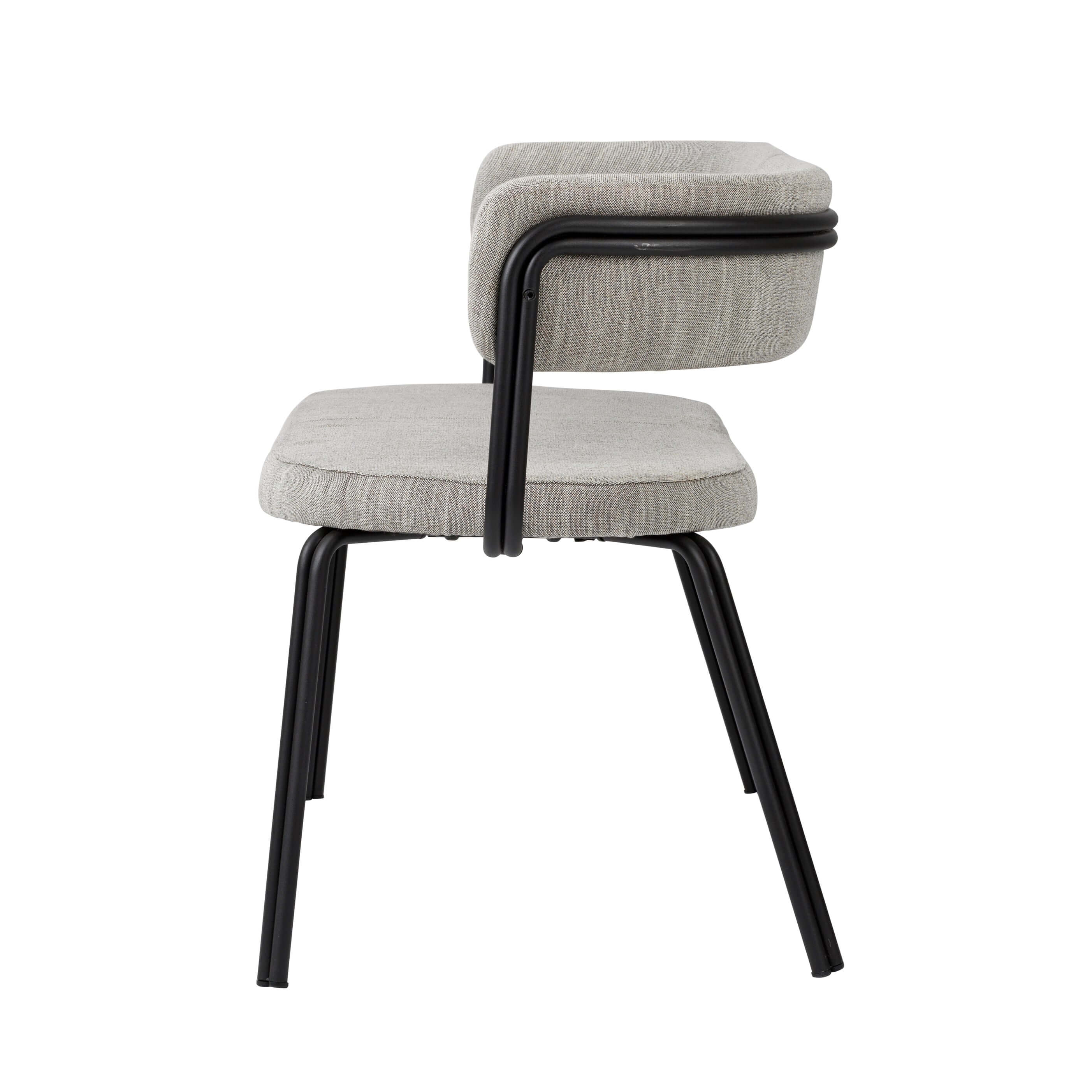 Side view of a modern chair with grey upholstery and black metal frame, epitomizing minimalist luxury furniture design.