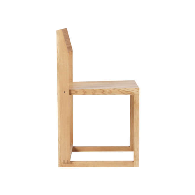 Outline Chair side view in FSC-certified oak, showcasing minimalist design ideal for luxury, modern, and curated furniture collections.