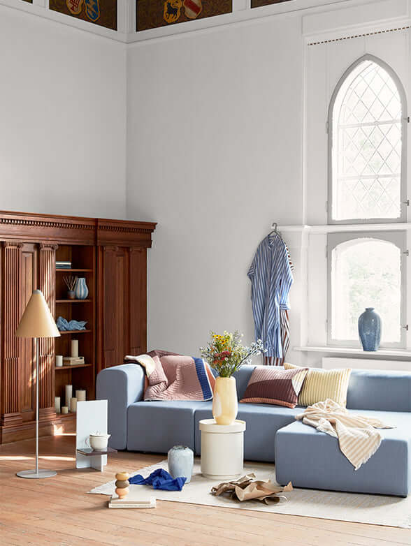 Modern living room with a modular Lagoon chaise longue, showcasing luxury Scandinavian design by Broste Copenhagen. Elegant home decor.