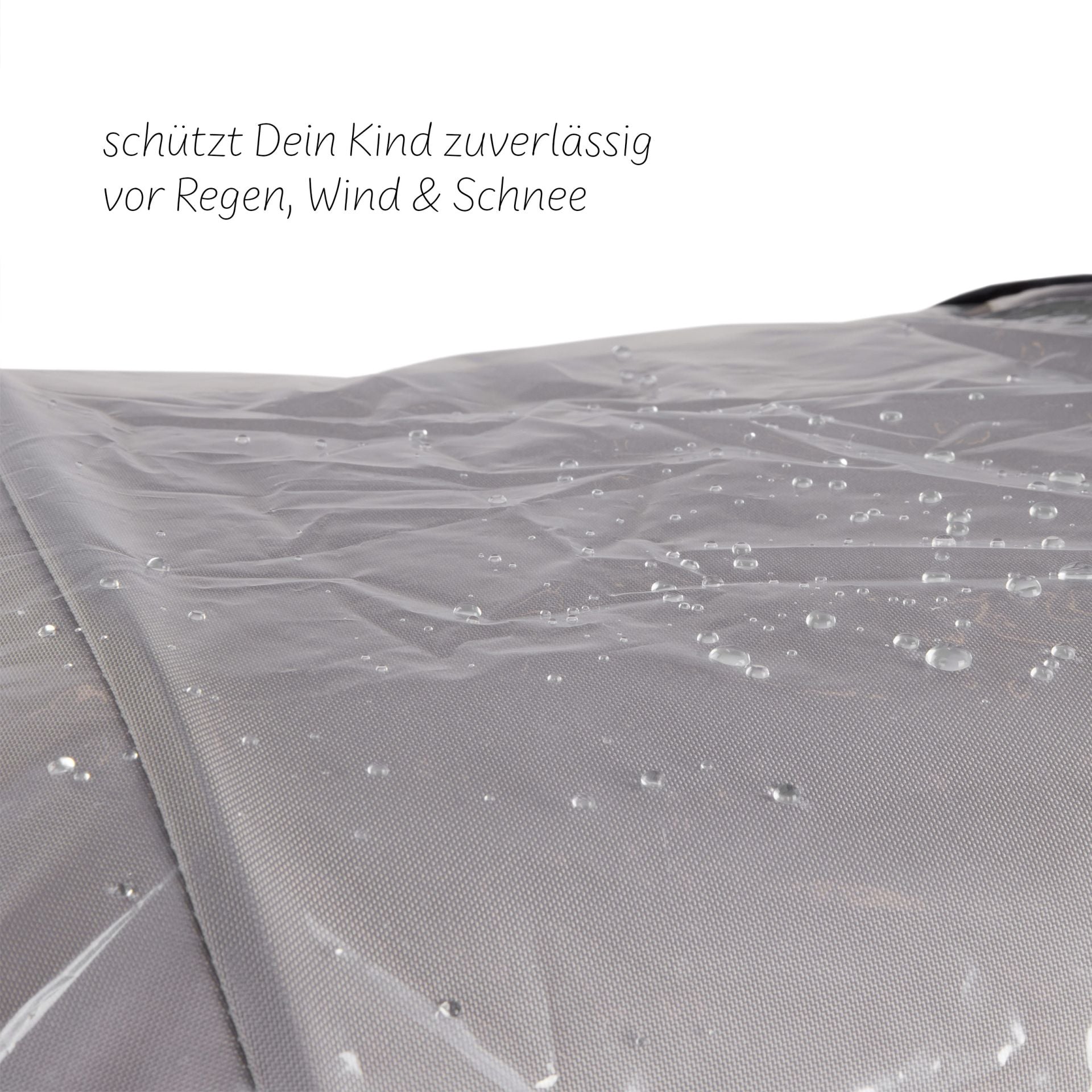 Close-up of ABC Design Double Pushchair Rain Cover with water droplets, showcasing luxury furniture accessories for modern families.