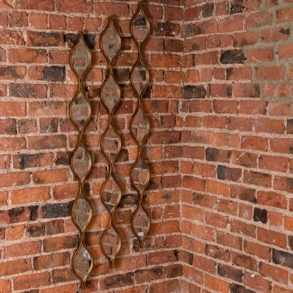 Decorative Hanging Gold Mirror on brick wall – Luxury Furniture, Designer Mirror, Modern Home Decor, Premium Furnishings.