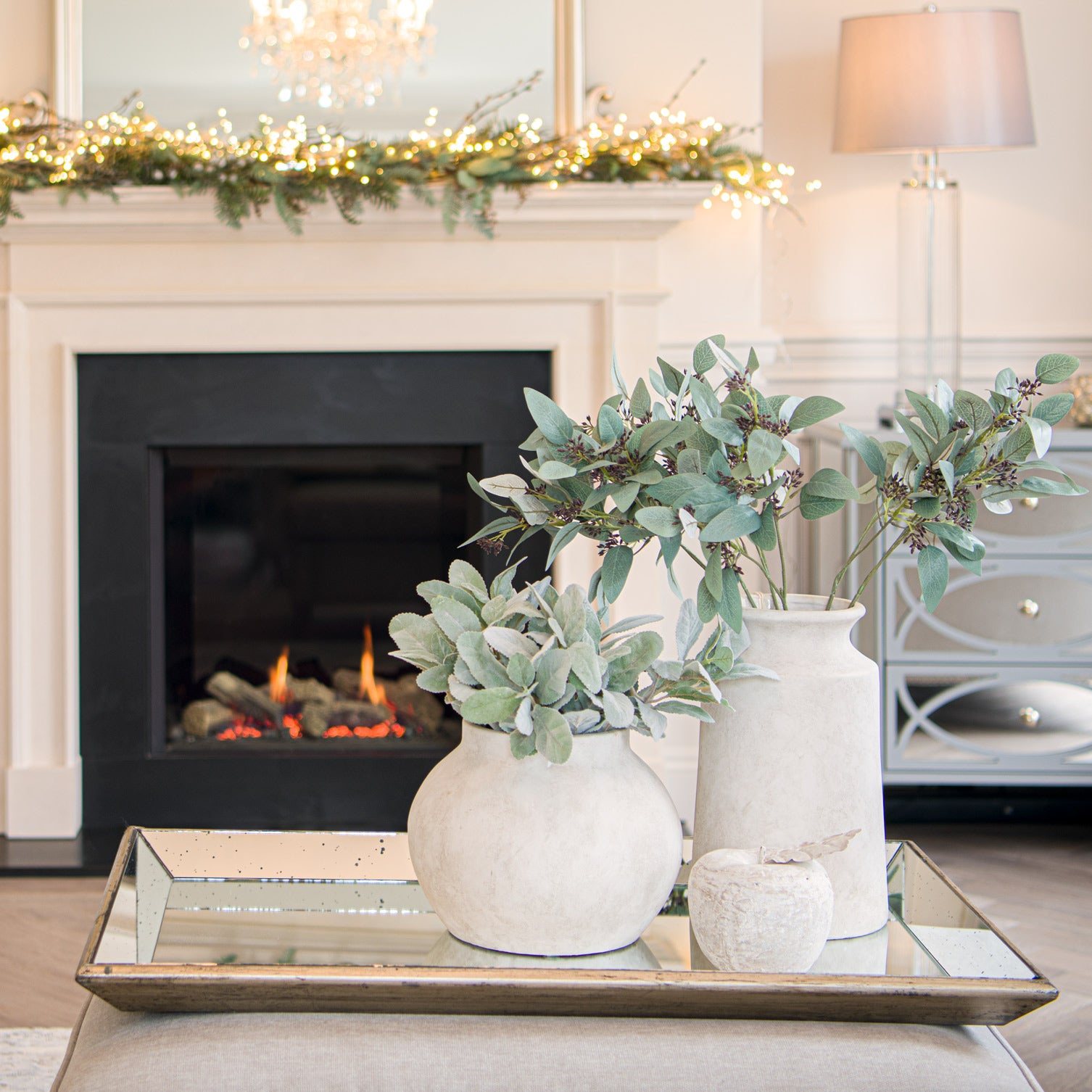 Darcy Urn Stone Vase in elegant modern living room setting with faux greenery, highlighting luxury and designer furniture.