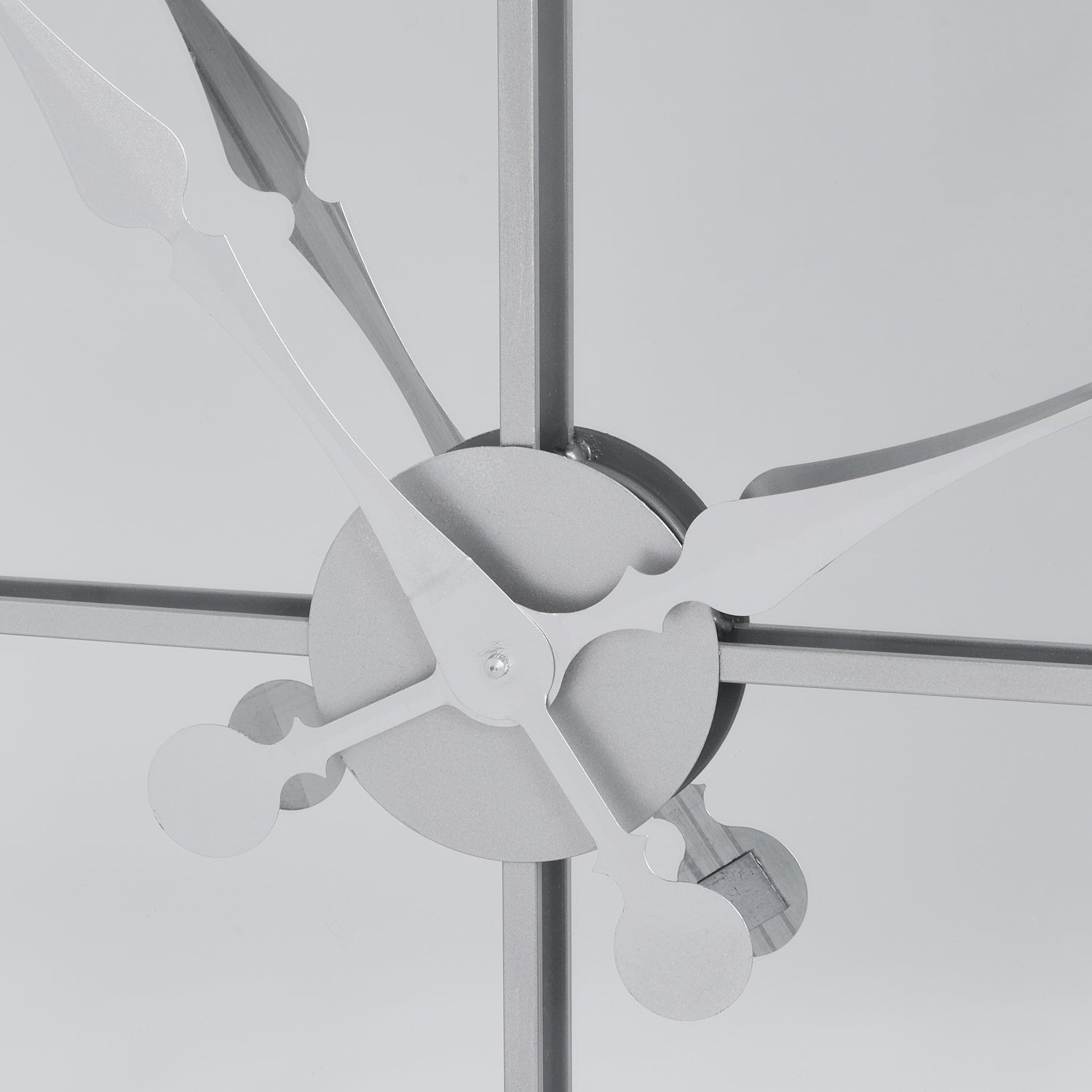 Close-up of Celina Mirrored Wall Clock's metal hands over glass, luxury designer modern furniture piece for high-end home decor.