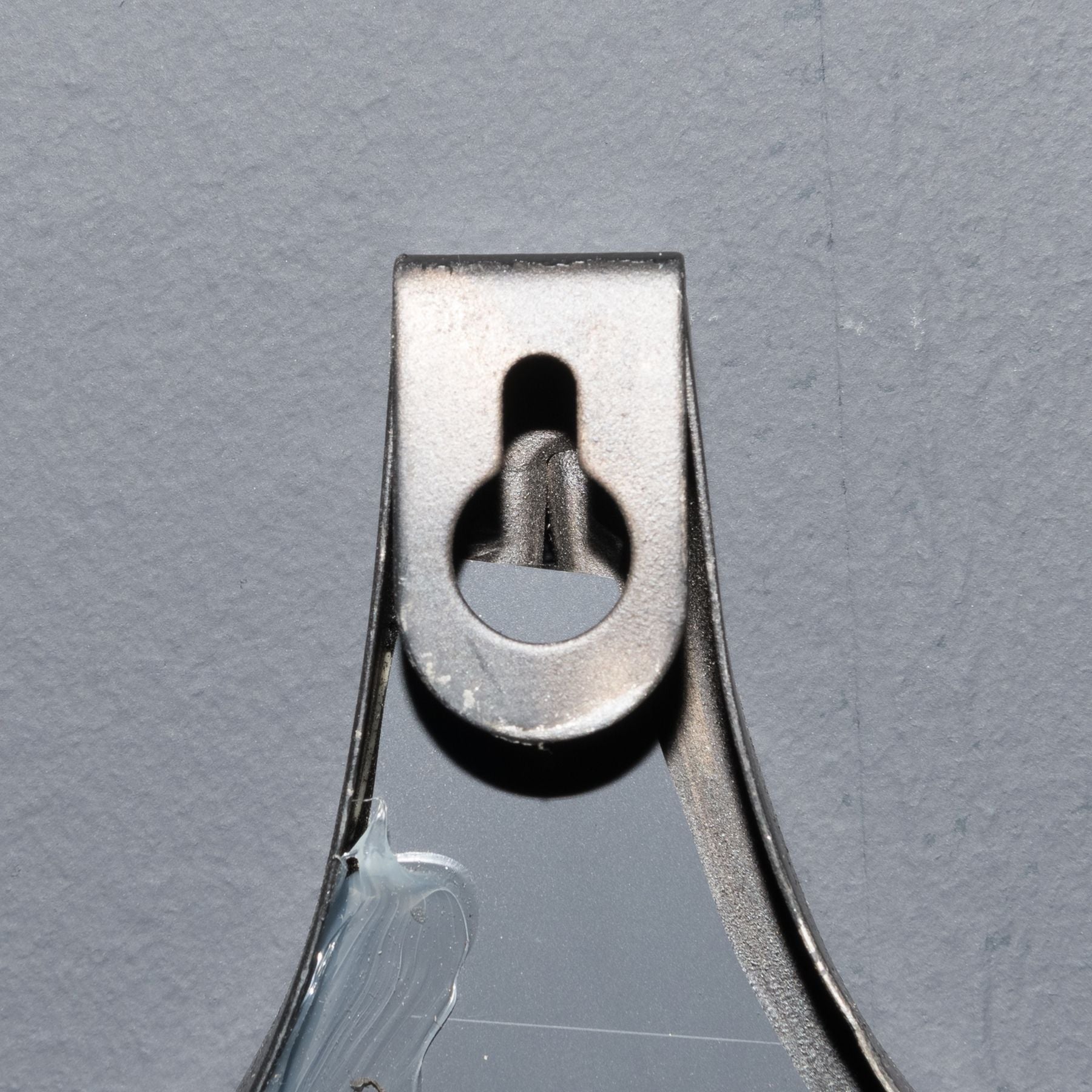 Sturdy hanging loop of a decorative black mirror, showcasing designer furniture details for modern luxury home decor.
