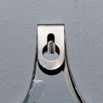 Sturdy hanging loop of a decorative black mirror, showcasing designer furniture details for modern luxury home decor.