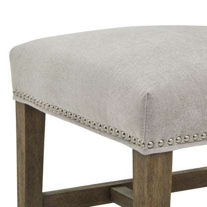 Cobham Grey Dining Chair showcasing luxury modern furniture with grey upholstery, antique brass studs, and a weathered oak frame.