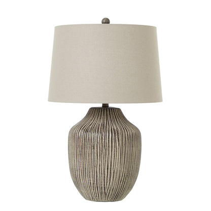 Ochre carved textured table lamp with linen shade; luxury designer furniture for modern home decor. Premium curated furnishings.