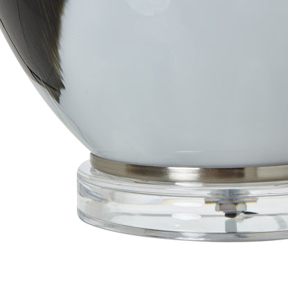 Close-up of grey glass table lamp base with ombre effect, showcasing premium luxury and designer home furnishings.