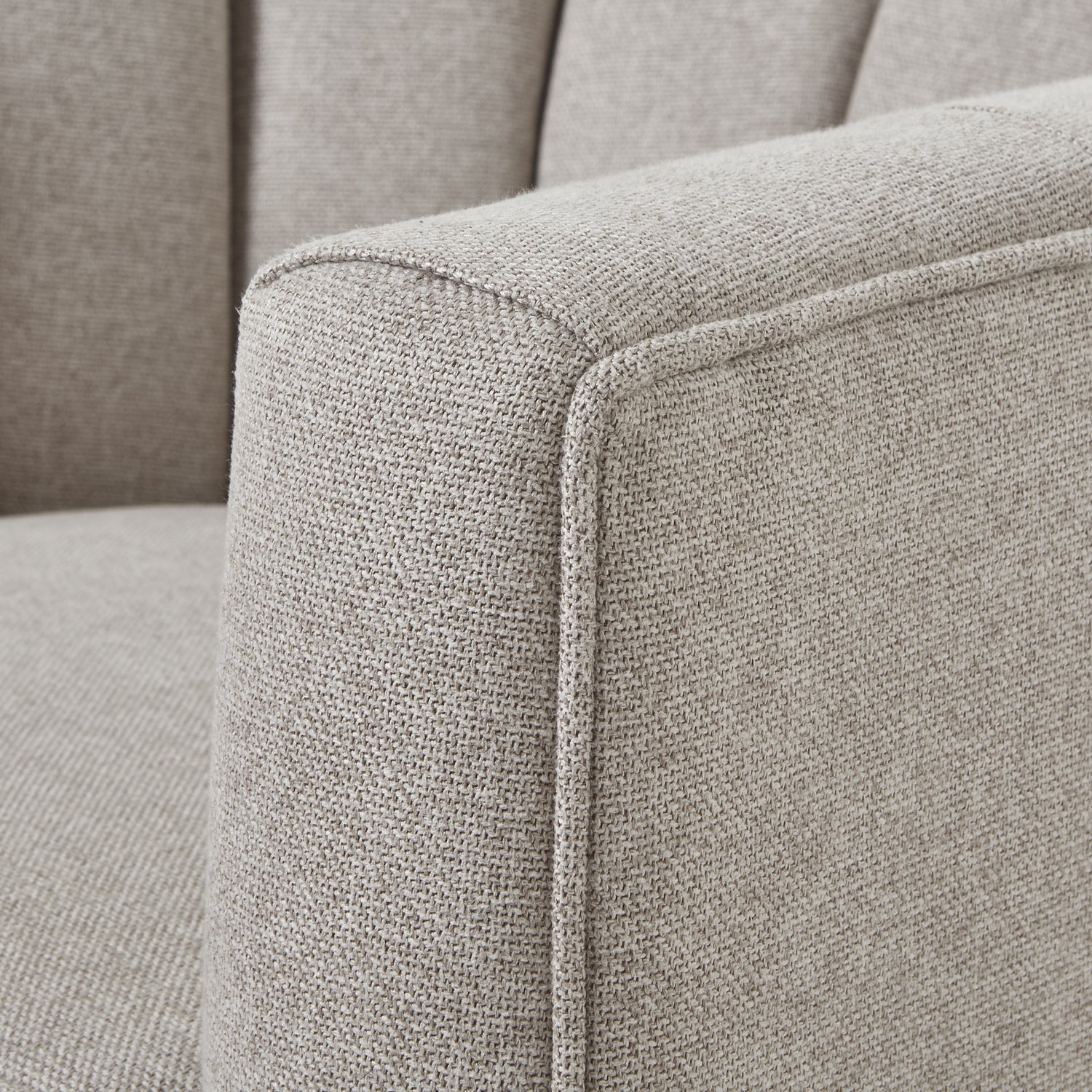 Close-up of Lily Swivel Chair in oatmeal twill, showcasing luxury modern designer furniture for premium home decor.