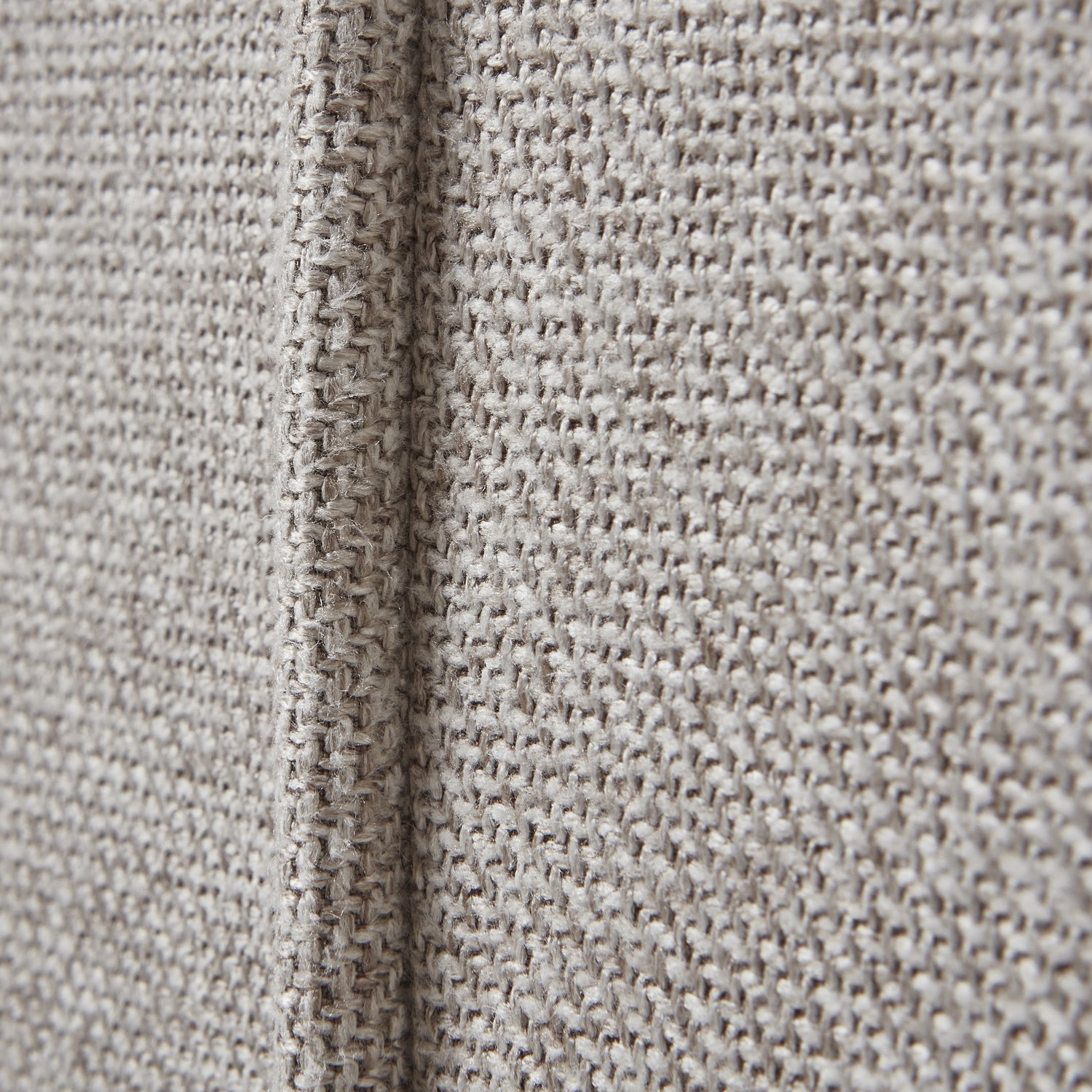 Close-up of oatmeal twill fabric texture on Lily Swivel Chair, highlighting luxury and modern design in premium home furnishings.