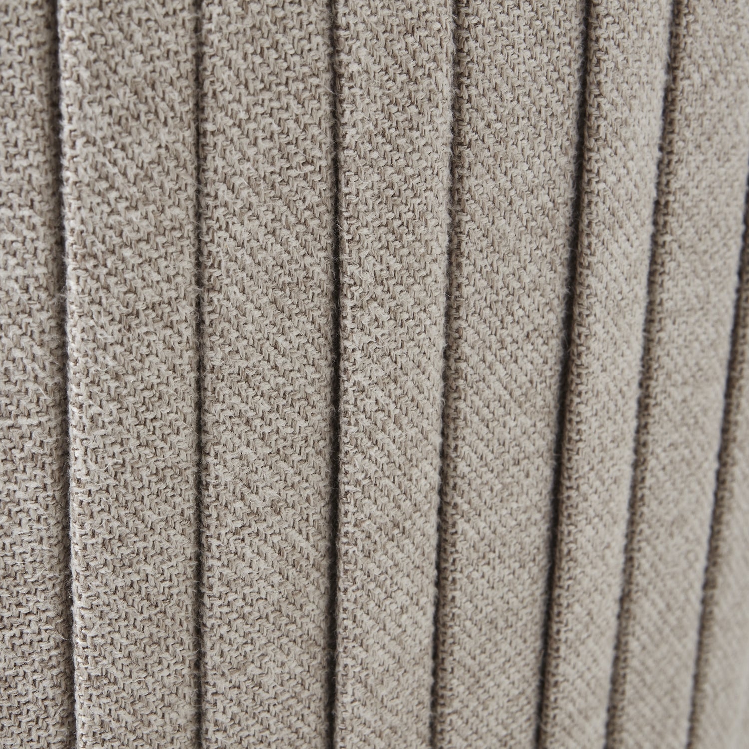 Textured oatmeal twill fabric detail of luxury Lily Swivel Ottoman, modern furniture for elegant interiors.