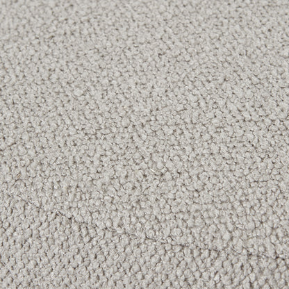 Close-up of Aspen Swivel Ottoman's plush upholstery in neutral hue, exemplifying luxury and modern designer furniture craftsmanship.