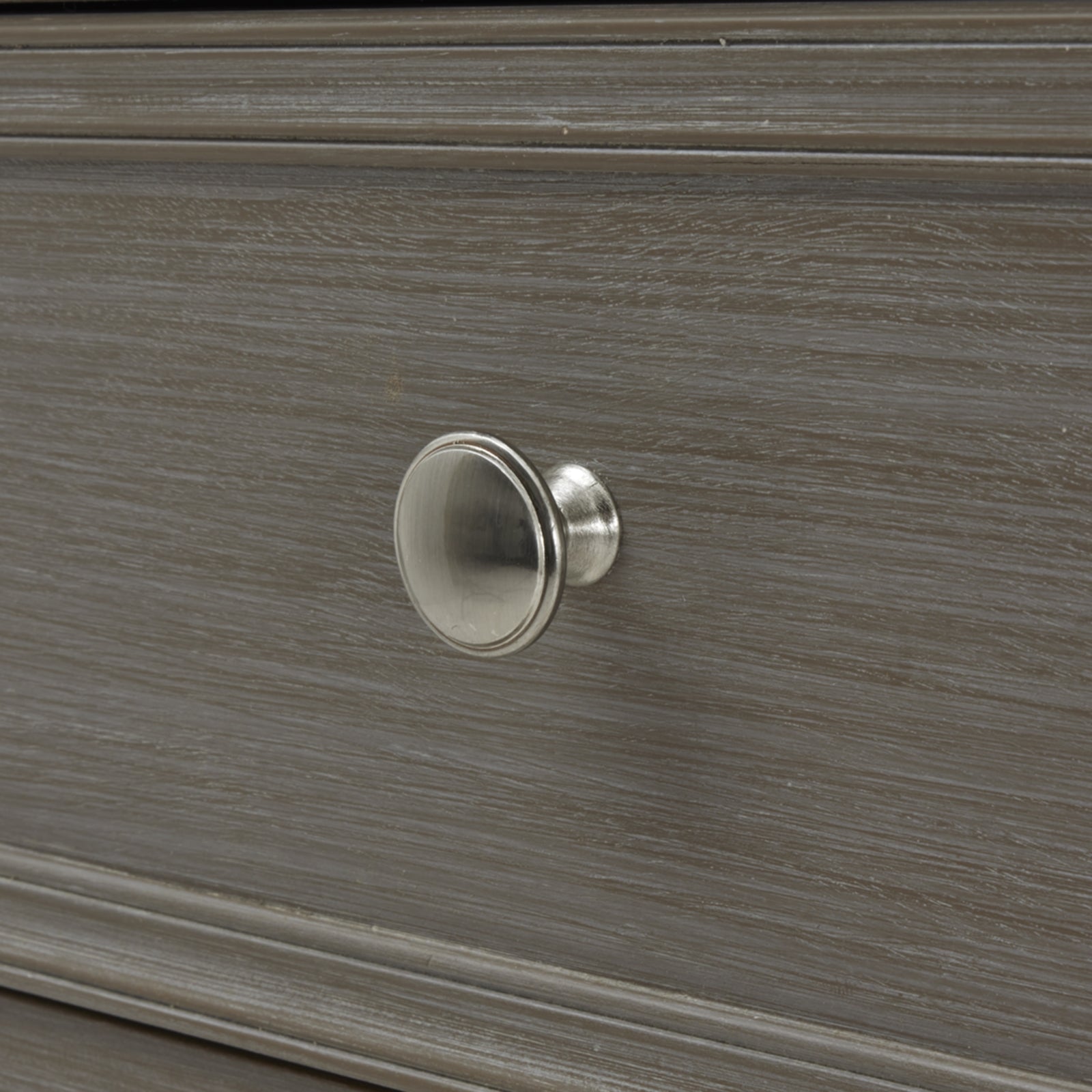 Close-up of The Serene Collection Two Over Two Chest knob, showcasing luxury and designer craftsmanship in modern furniture.