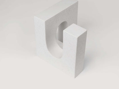 Minimalist white brick sculpture with a modern design, part of a curated furniture collection. Ideal for luxury and designer interiors.