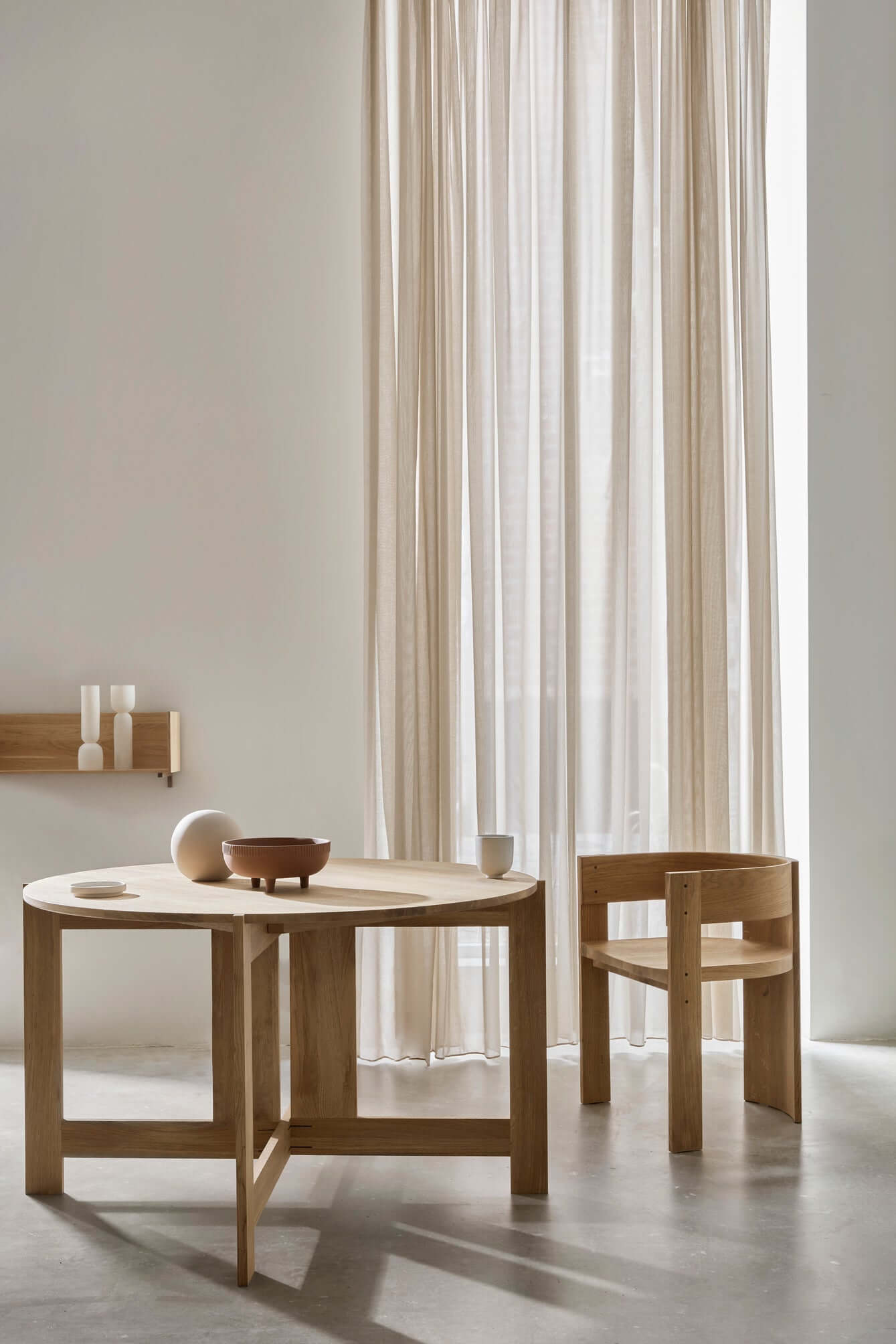 Minimalist dining space featuring the Collector Dining Chair in premium oak, showcasing luxury and modern design. Perfect for high-end decor.