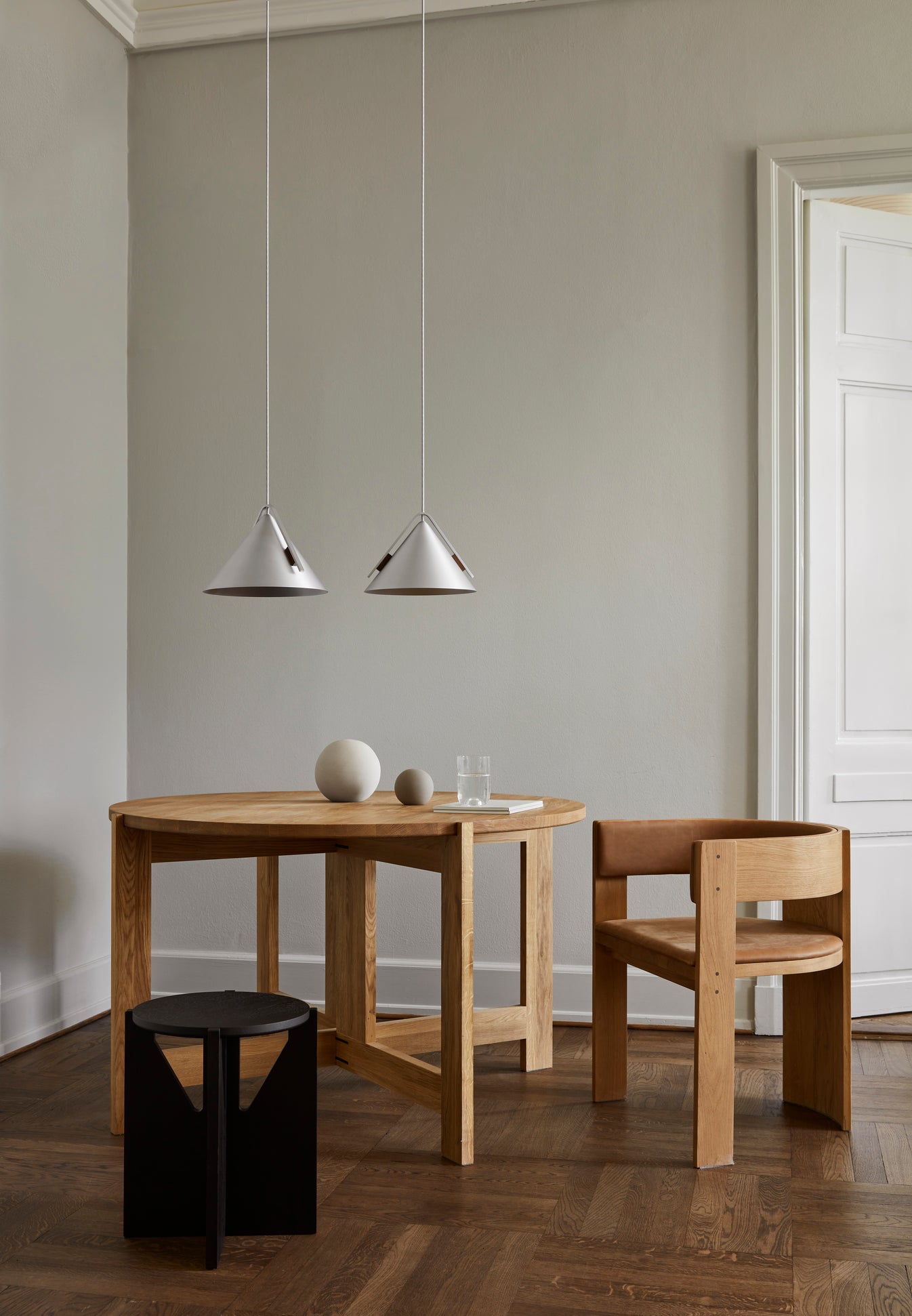 Collector Dining Chair – Leather Upholstery in elegant room; modern luxury and designer furniture by premium home furnishings brand. Keywords: Luxury Furniture, Designer Furniture, Modern Furniture.