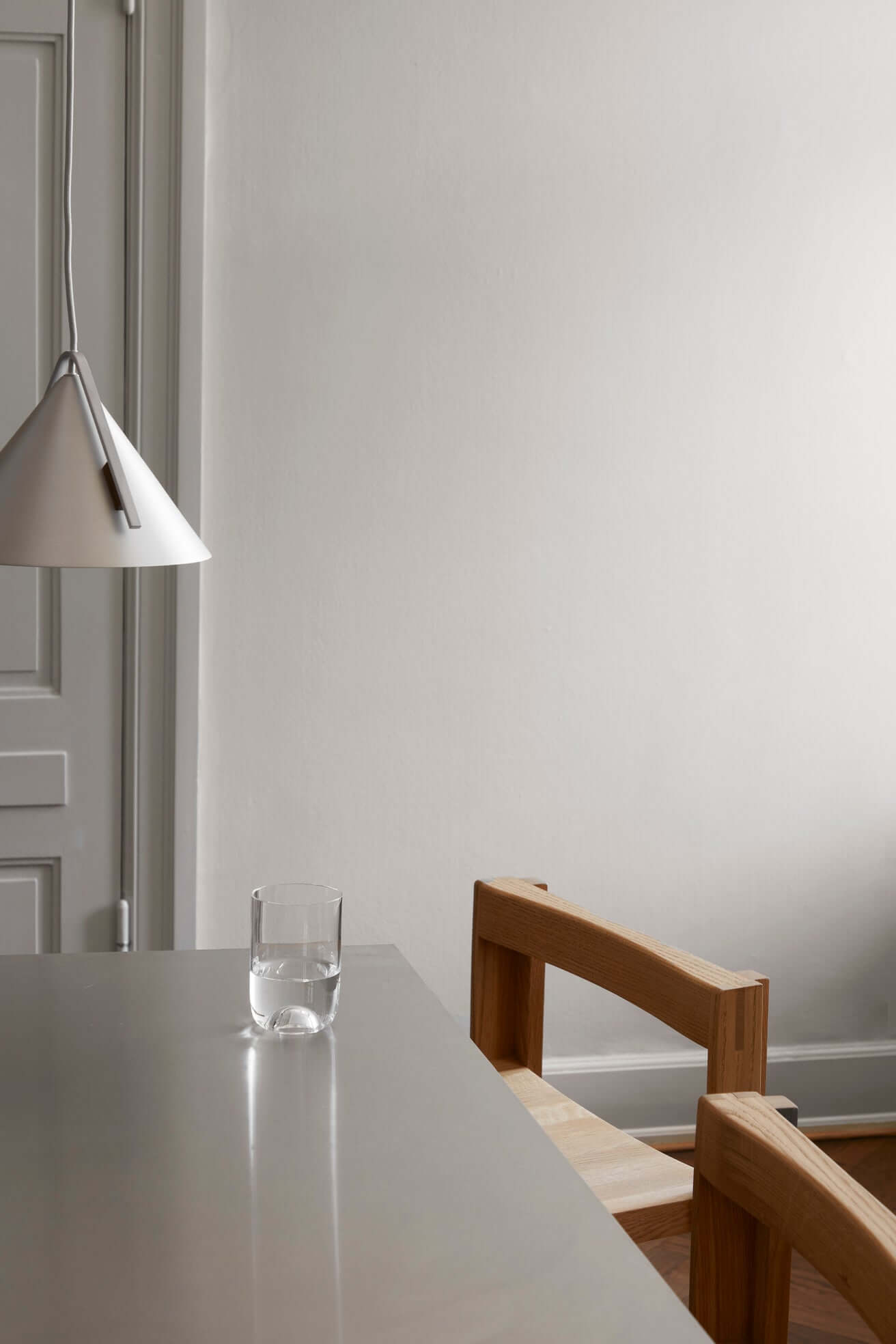 Luxury modern bar chair and lamp in minimalist setting, showcasing sustainable oak craftsmanship, perfect for high-end home decor.