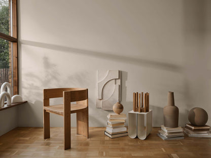 Collector Dining Chair in refined oak, exuding luxury and modern design, perfect for high-end home decor and premium furniture collections.