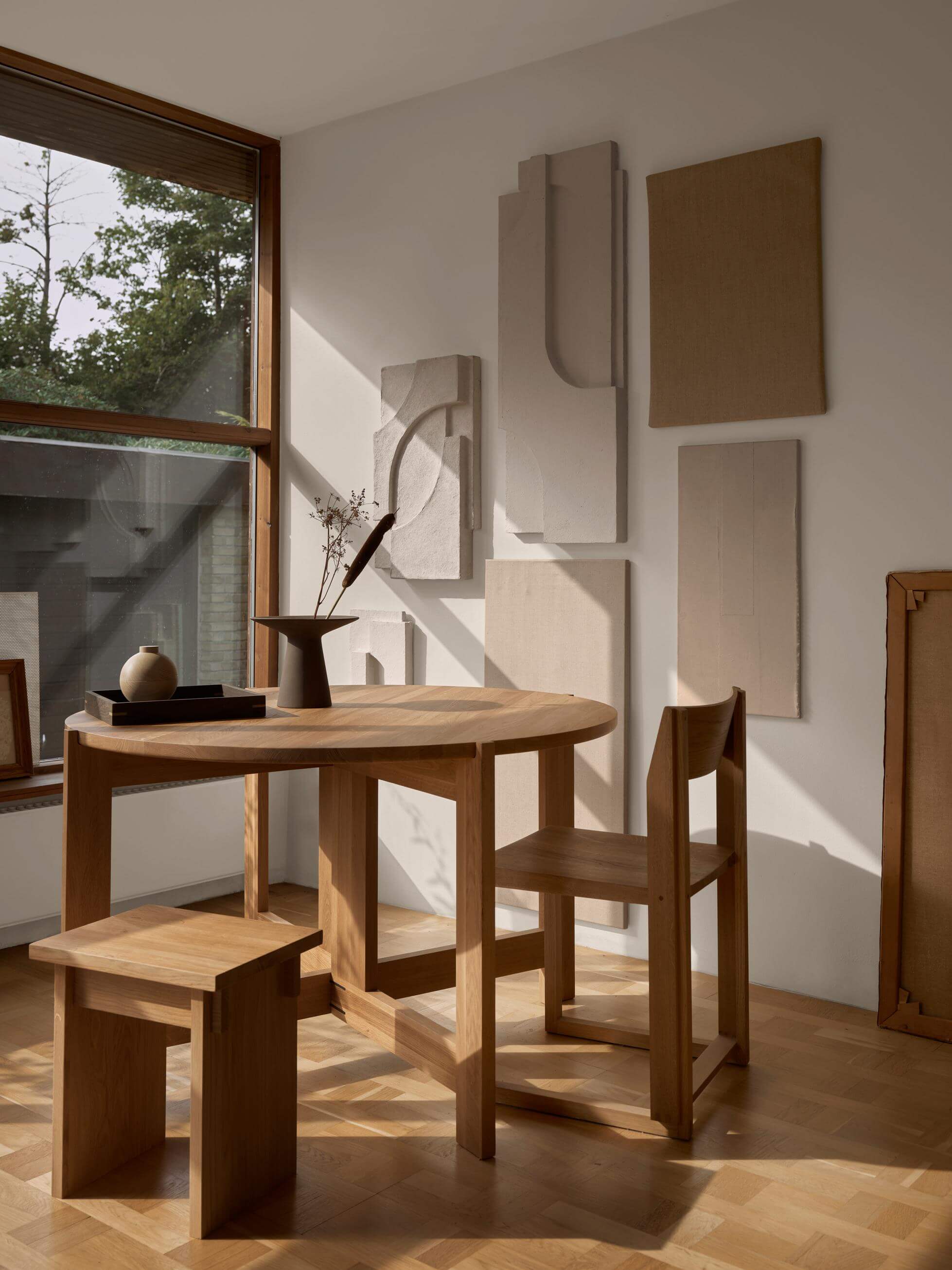 Outline Chair by {{ product.vendor }} in a modern space, showcasing minimalist design and sustainable luxury craftsmanship.
