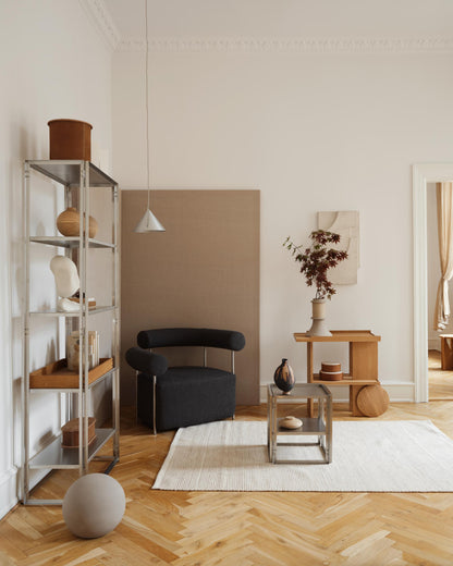 Modern living room featuring a Kristen Dam Studio foldable shelf and luxury furniture. Designer and premium home decor setup.