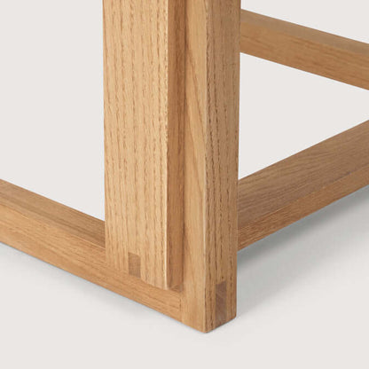 Detail of Outline Bar Chair High showing FSC-certified oak craftsmanship in luxury designer furniture.