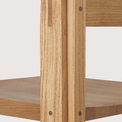 Detail of FSC-certified oak on Outline Bar Chair High, showcasing sustainable craftsmanship and modern design in luxury furniture.
