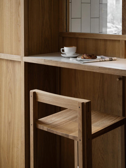 Outline Bar Chair High in oak at a kitchen island, showcasing luxury and modern design. Part of curated premium home furnishings collection.