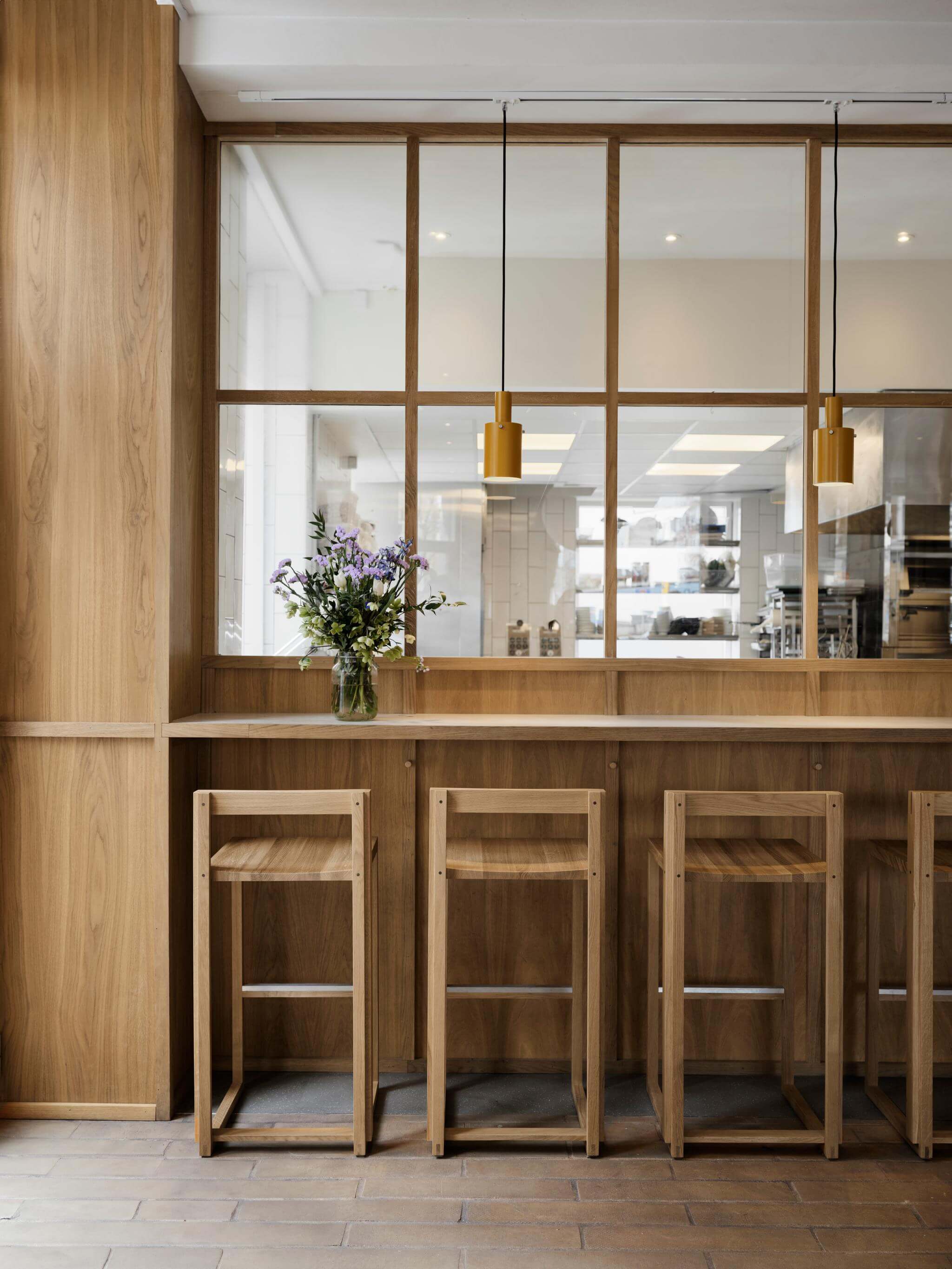 Luxury designer Outline Bar Chair High in FSC-certified oak, perfect modern furniture for upscale bar and kitchen decor.