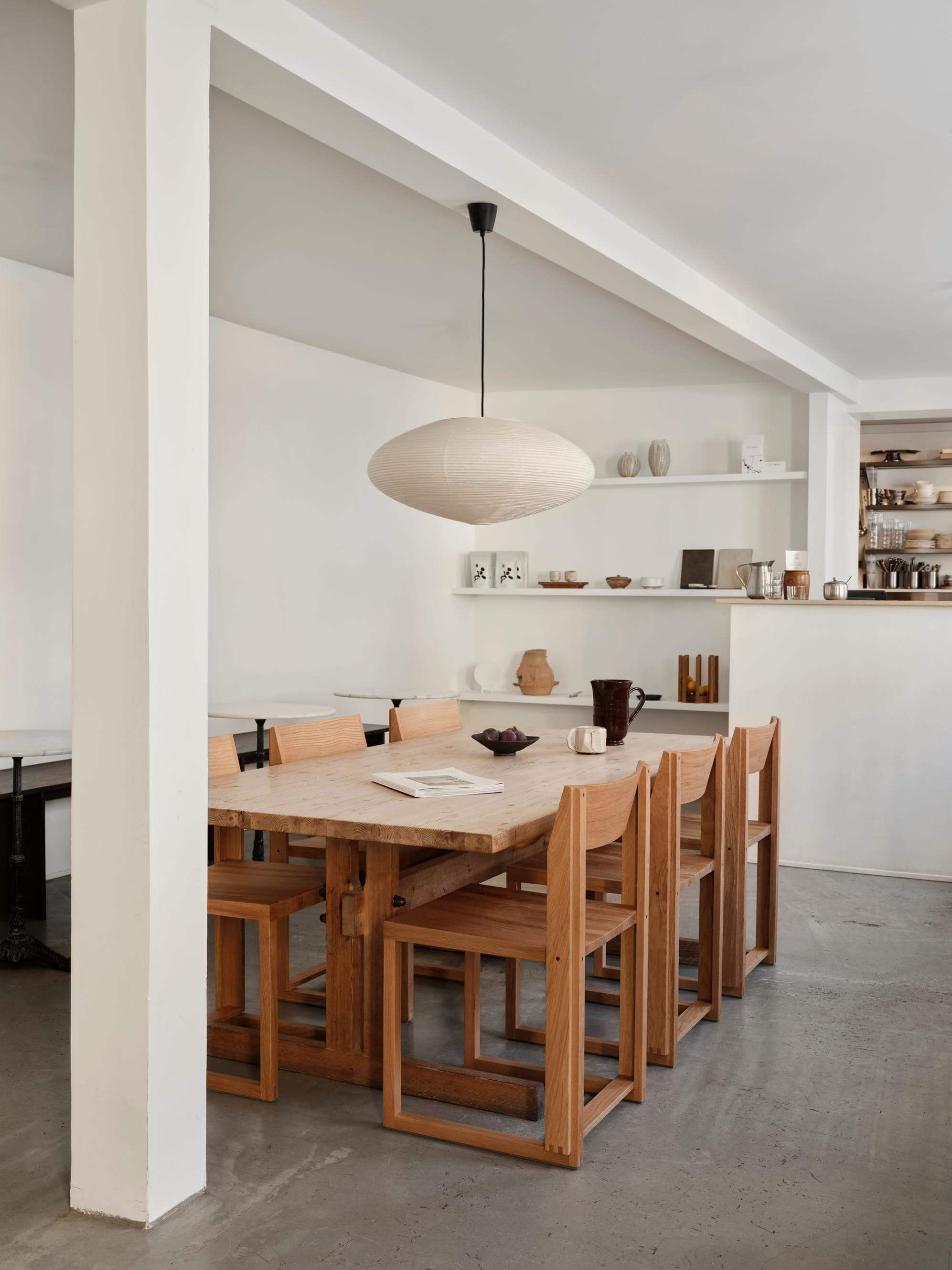 Modern dining room with Outline Chair, showcasing minimalist design and sustainable craftsmanship. Luxury and designer furniture setup.