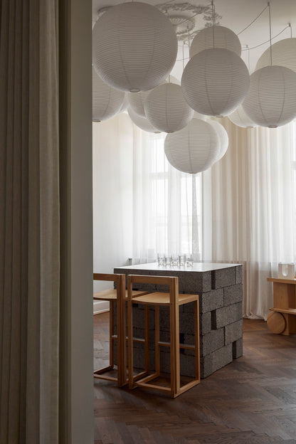 Modern interior with geometric furniture and paper lanterns, showcasing luxury and designer style for premium home decor.