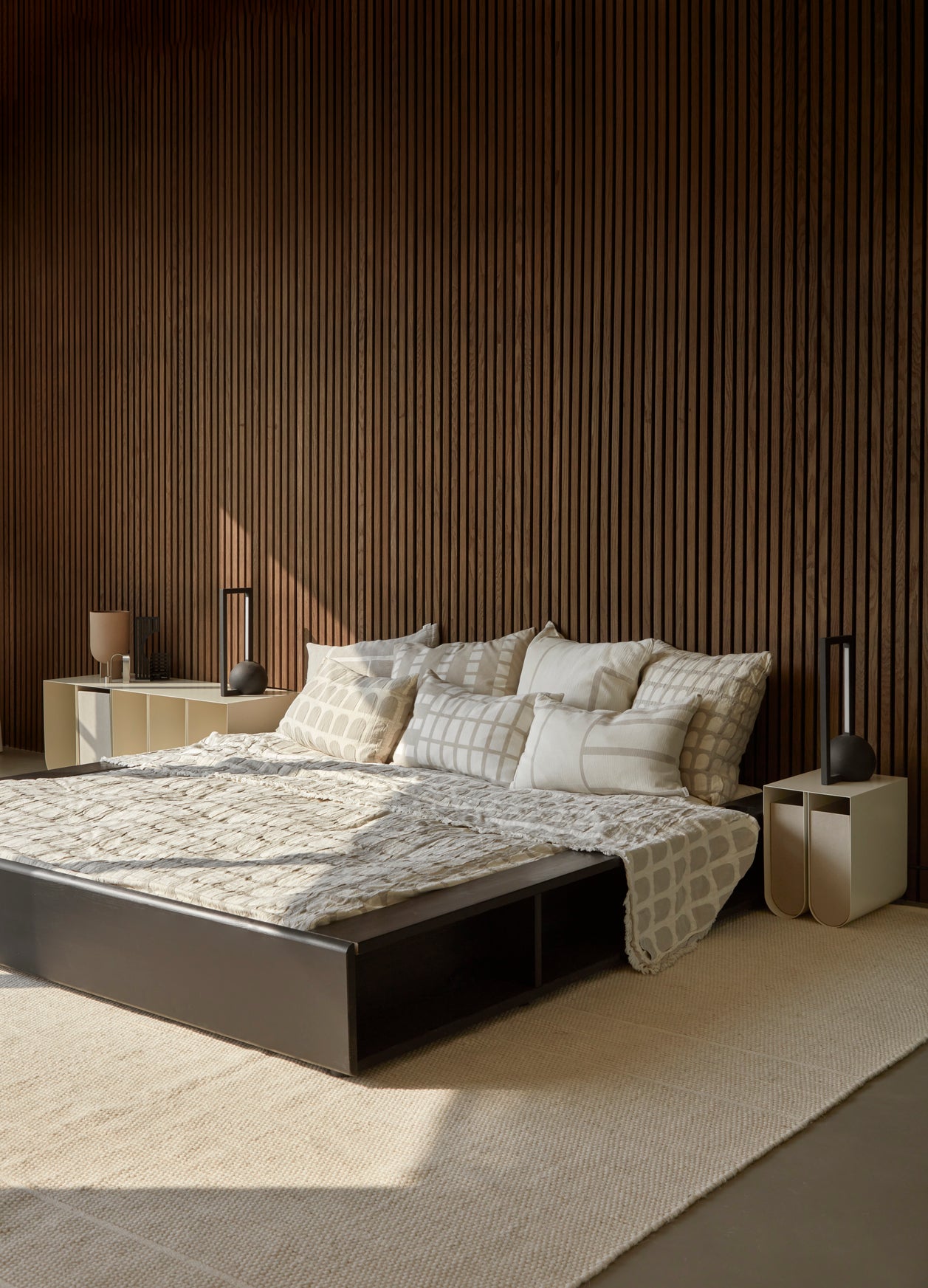 Luxury modern bedroom with designer bed and minimalist Curved Side Table S, showcasing premium home furnishings in a curated collection.
