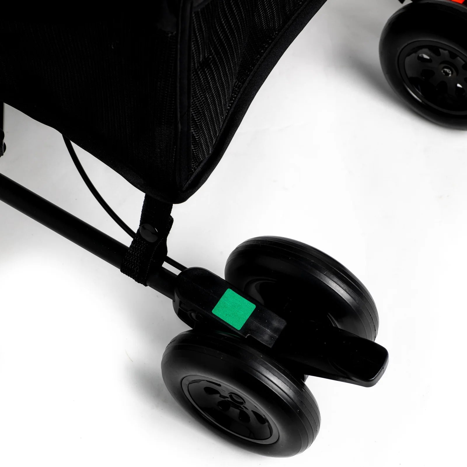 Close-up of Roma Rizzo 2 Teddy Cream stroller wheels, showcasing lightweight design and modern luxury furniture style.