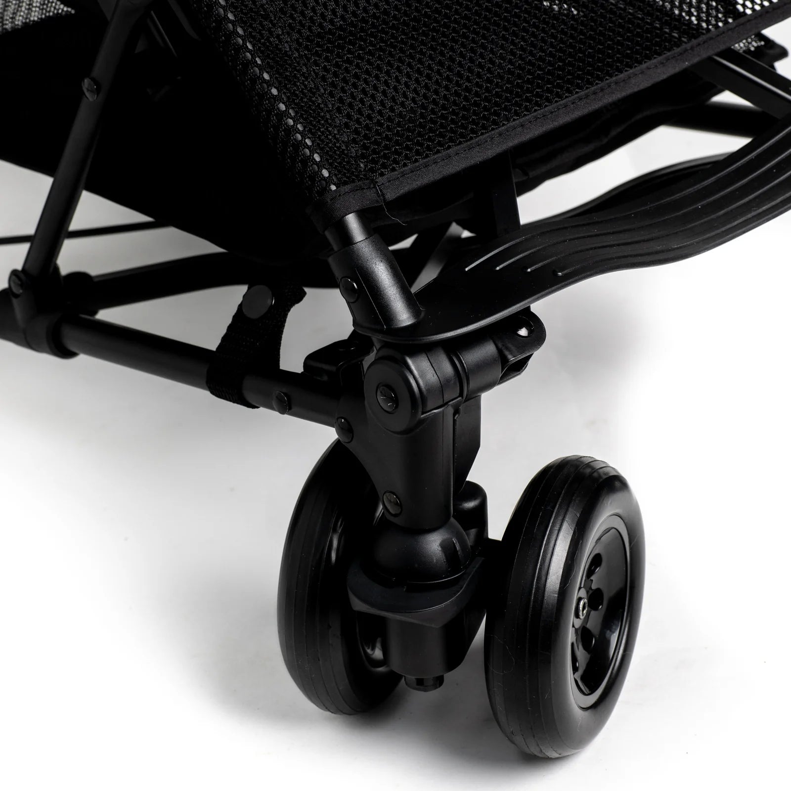 Close-up of Roma Rizzo 2 Teddy Cream Stroller wheel and frame, showcasing luxury, modern design, and lightweight convenience.
