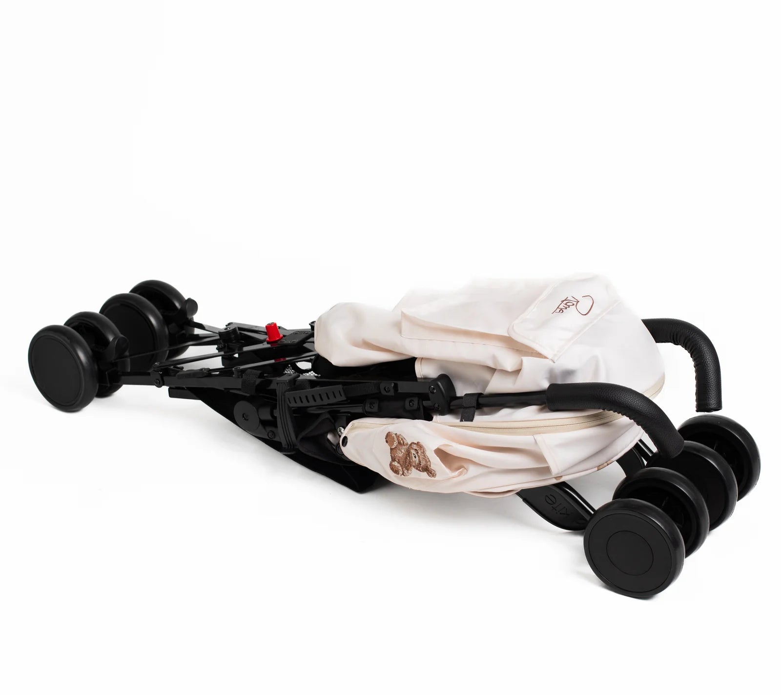 Alt Tag: Roma Star - Teddy Cream Stroller folded, showcasing luxury and modern design for travel; perfect for premium home furnishings.